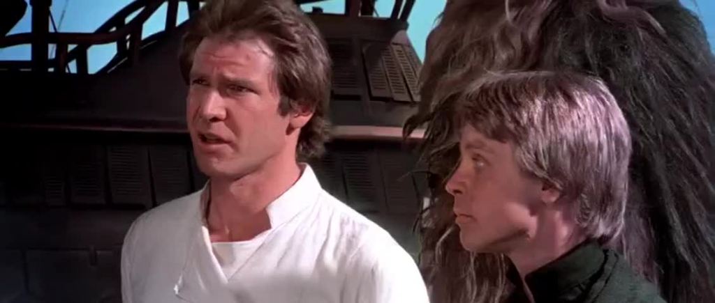 Screenshot from Return of the Jedi: closeup of Han and Luke having a conversation outside